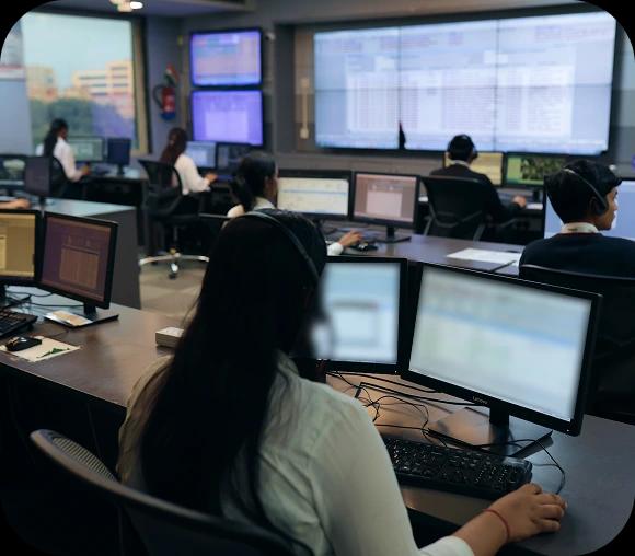 Secondary Control Room Image 2: Operator using multiple monitors to review alerts inside the alarm monitoring centre.